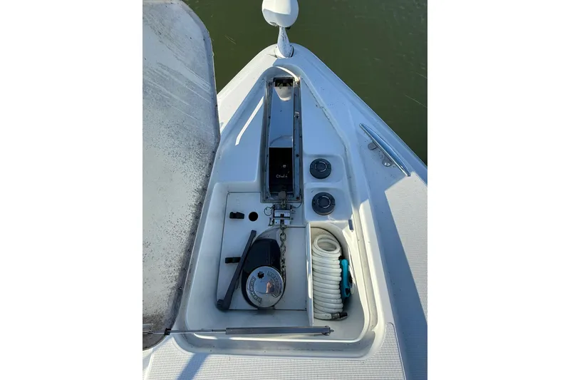 Slide: The Image of 2005 Formula 37 Performance Cruiser anchor compartment with coiled hose and equipment. - 6