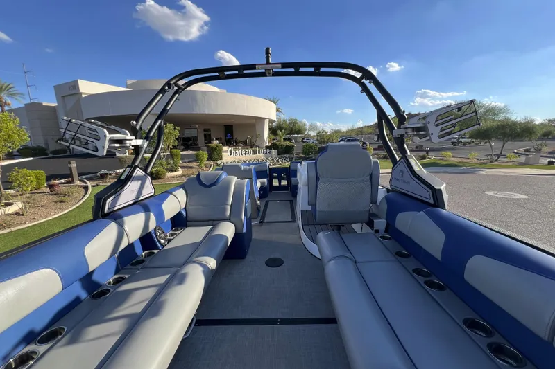 Slide: The Image of 2024 Montara 23 SURF BOSS 2.0 boat interior with blue and gray seating. - 6