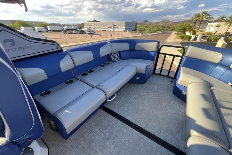 Slide: The Image of 2024 Montara 23 SURF BOSS 2.0 boat interior with blue and gray seating. - 7
