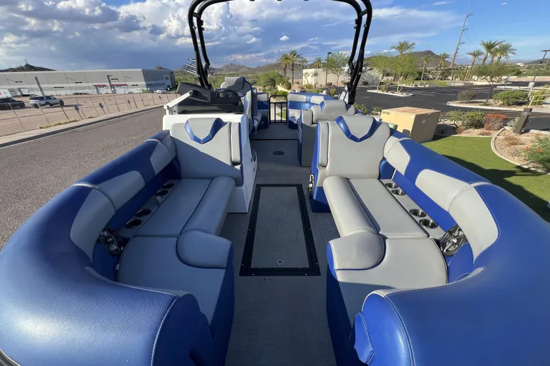 Slide: The Image of 2024 Montara 23 SURF BOSS 2.0 boat interior with blue and gray seating. - 9