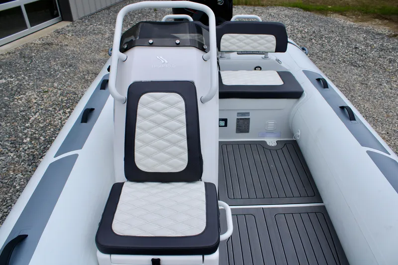 Slide: The Image of 2024 Highfield Sport 460 boat interior with cushioned seating and sleek design. - 15