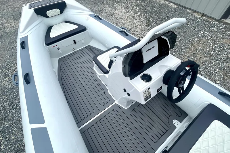 Slide: The Image of 2024 Highfield Sport 460 boat interior with modern console and seating. - 5