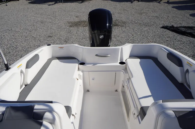 Slide: The Image of 2024 Bayliner Element E18 boat interior with seating and motor view. - 13
