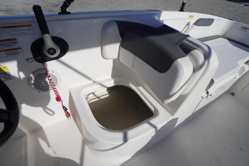 Slide: The Image of 2024 Bayliner Element E18 boat interior with storage compartment and seating. - 20