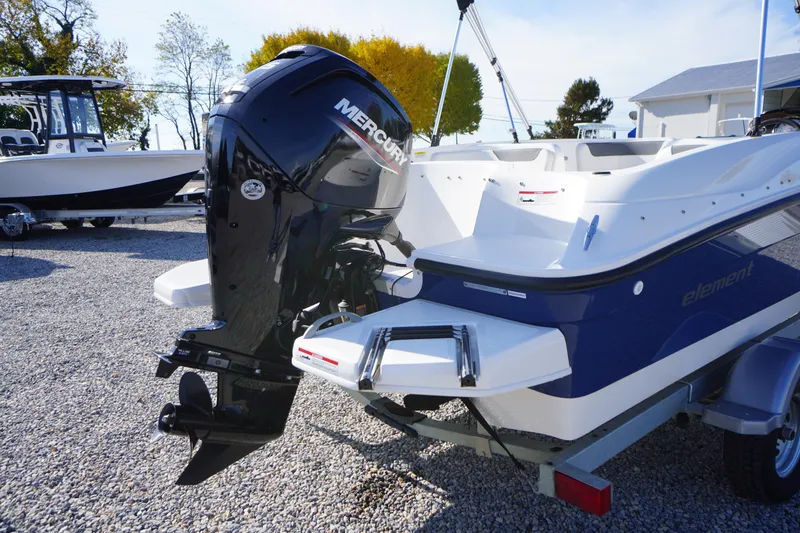 Slide: The Image of 2024 Bayliner Element E18 boat with Mercury outboard motor on trailer. - 22