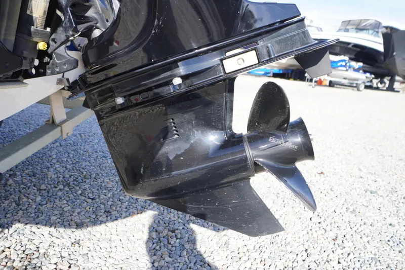 Slide: The Image of 2024 Bayliner Element E18 boat propeller on gravel surface. - 25