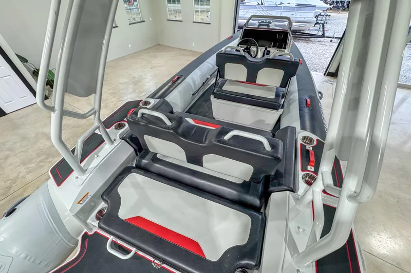 Slide: The Image of 2026 Highfield Velox 560 boat interior with modern seating and steering console. - 10