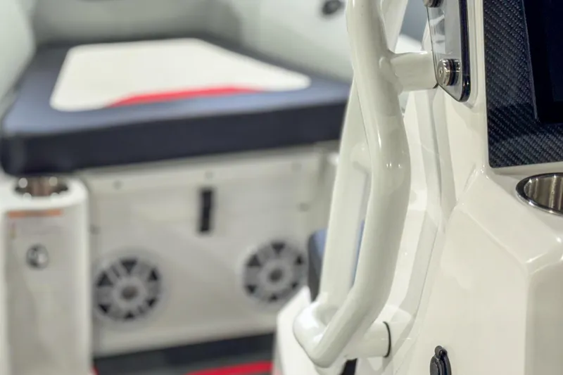 Slide: The Image of 2026 Highfield Velox 560 boat interior with seating and audio speakers. - 20