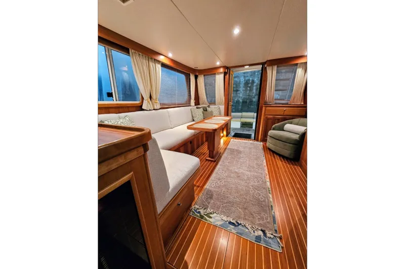Slide: The Image of Luxurious interior of 2005 Alden 49 Flybridge Express Cruiser with elegant wood finishes. - 13