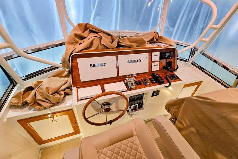 Slide: The Image of Helm of 2005 Alden 49 Flybridge Express Cruiser with Simrad navigation equipment. - 17