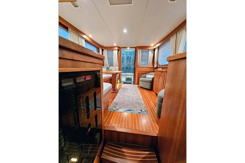 Slide: The Image of Luxurious interior of 2005 Alden 49 Flybridge Express Cruiser with elegant wood finishes. - 20