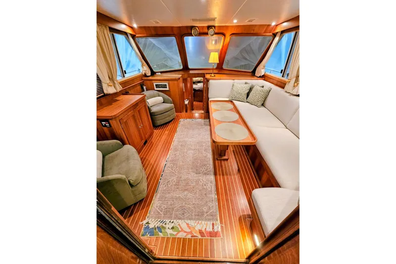 Slide: The Image of Luxurious interior of 2005 Alden 49 Flybridge Express Cruiser with elegant wood finishes. - 21