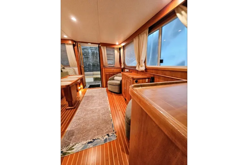Slide: The Image of Luxurious interior of 2005 Alden 49 Flybridge Express Cruiser with elegant wood finishes. - 22