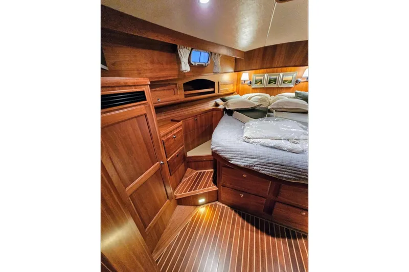 Slide: The Image of Luxurious wooden interior of 2005 Alden 49 Flybridge Express Cruiser cabin. - 36