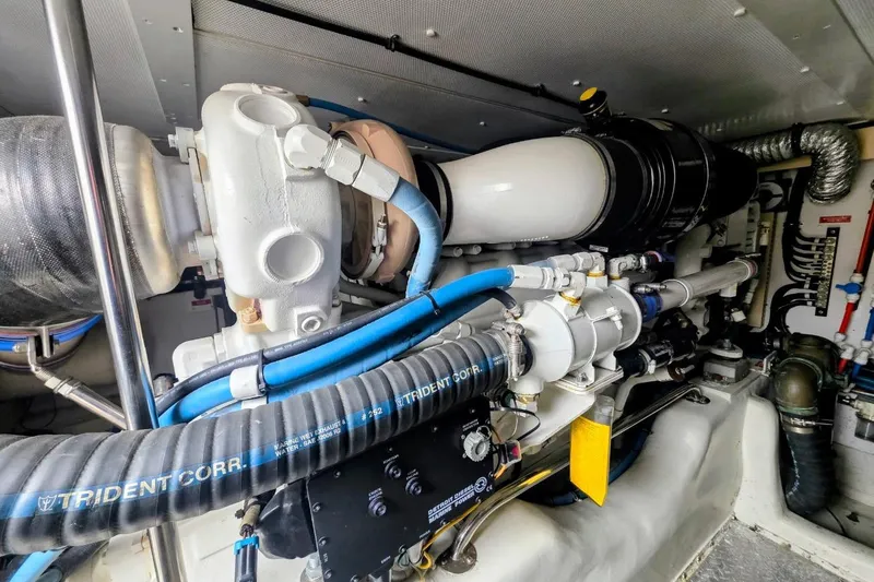 Slide: The Image of Engine room of 2005 Alden 49 Flybridge Express Cruiser with visible mechanical components. - 39