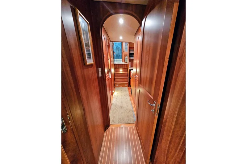Slide: The Image of Luxurious wooden interior of 2005 Alden 49 Flybridge Express Cruiser yacht hallway. - 41