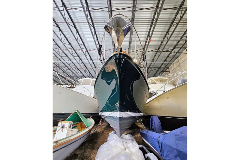 Slide: The Image of 2005 Alden 49 Flybridge Express Cruiser in storage, front view. - 9