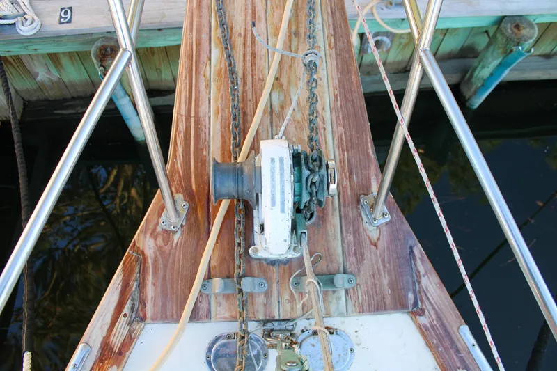 Slide: The Image of Bow of 1990 Island Packet 32 sailboat with anchor windlass and chain. - 12