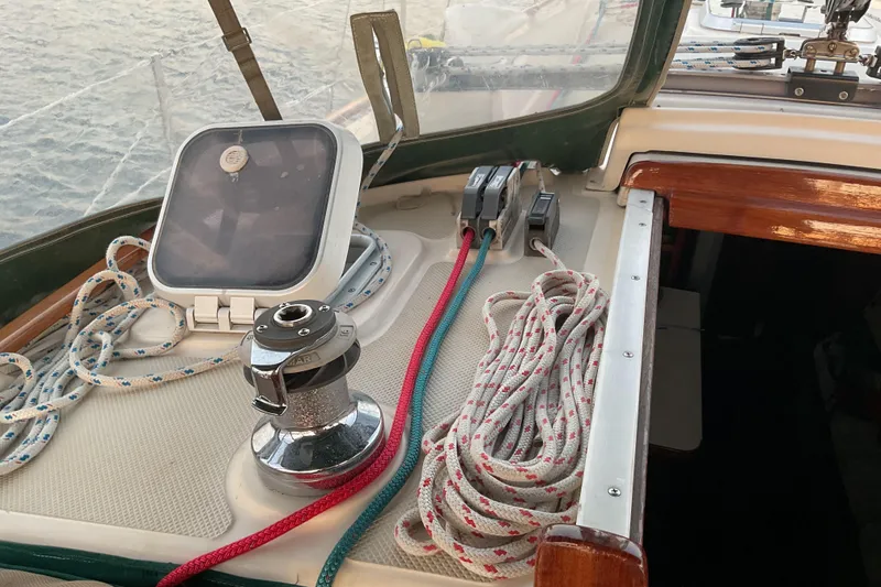 Slide: The Image of Cockpit of 1990 Island Packet 32 sailboat with ropes and winch. - 17