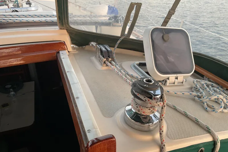 Slide: The Image of Cockpit of a 1990 Island Packet 32 sailboat with winch and ropes. - 18
