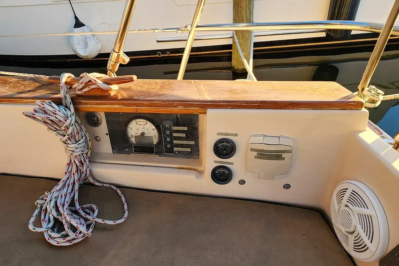 Slide: The Image of Control panel of a 1990 Island Packet 32 sailboat with coiled rope. - 22