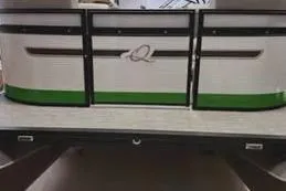 The Image of 2023 Qwest RLS 822 boat with green and white exterior design. - 0