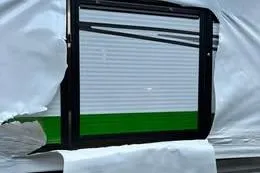 Slide: The Image of 2023 Qwest RLS 822 vehicle window partially covered with protective wrap. - 1