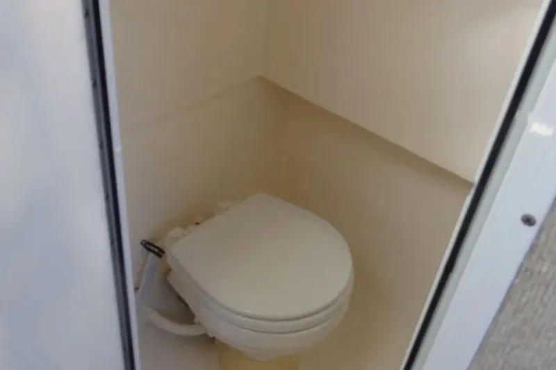 Slide: The Image of Compact bathroom with toilet in 2001 Shamrock 26 model. - 12