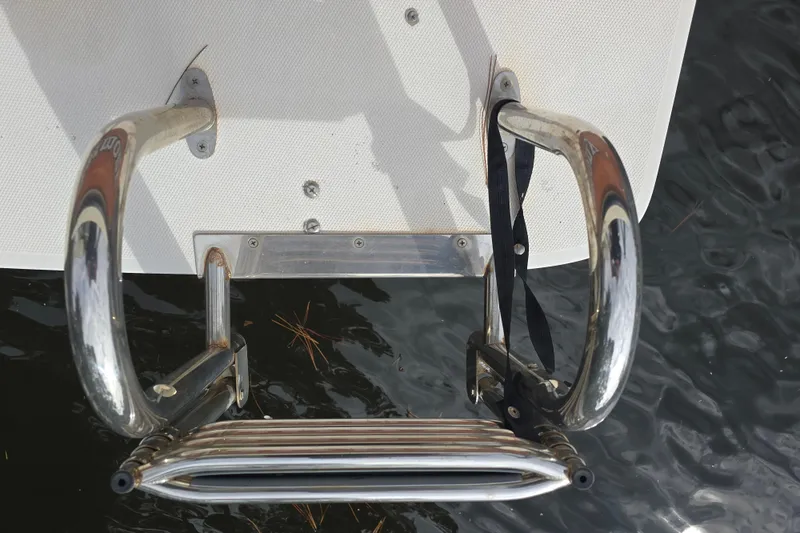 Slide: The Image of Stainless steel boat ladder on a 2001 Shamrock 26, above water surface. - 16