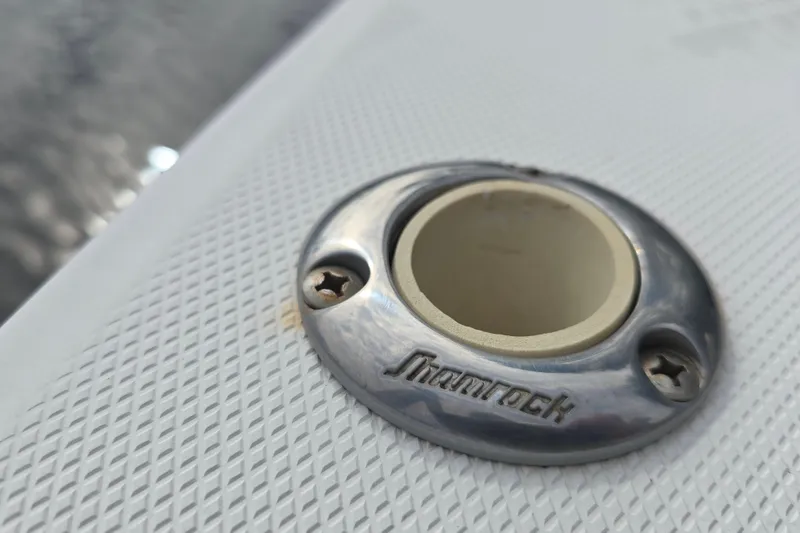 Slide: The Image of Close-up of a Shamrock 26 boat fitting, 2001 model, on textured surface. - 6