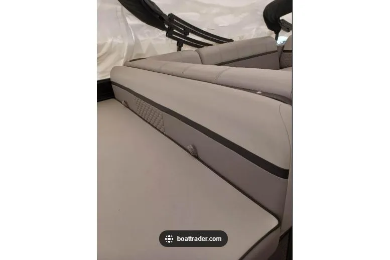 Slide: The Image of 2023 Qwest Lanai 822 boat interior with sleek, modern seating design. - 3