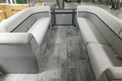Slide: The Image of 2023 Qwest Lanai 822 interior with gray seating and wood-patterned flooring. - 4