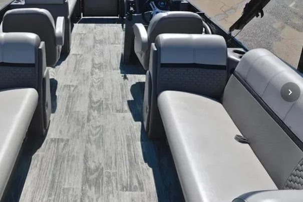 Slide: The Image of Interior of 2023 Qwest RLS 822 pontoon boat with gray seating and flooring. - 3