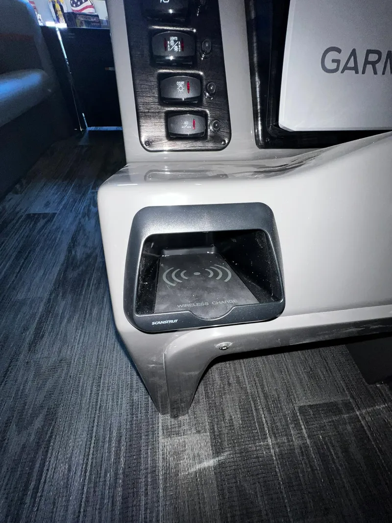 Slide: The Image of 2023 Qwest RLS 822 interior with Garmin device and wireless charging station. - 11