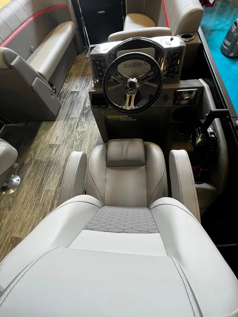Slide: The Image of Interior of 2023 Qwest RLS 822 boat with Garmin steering system. - 12