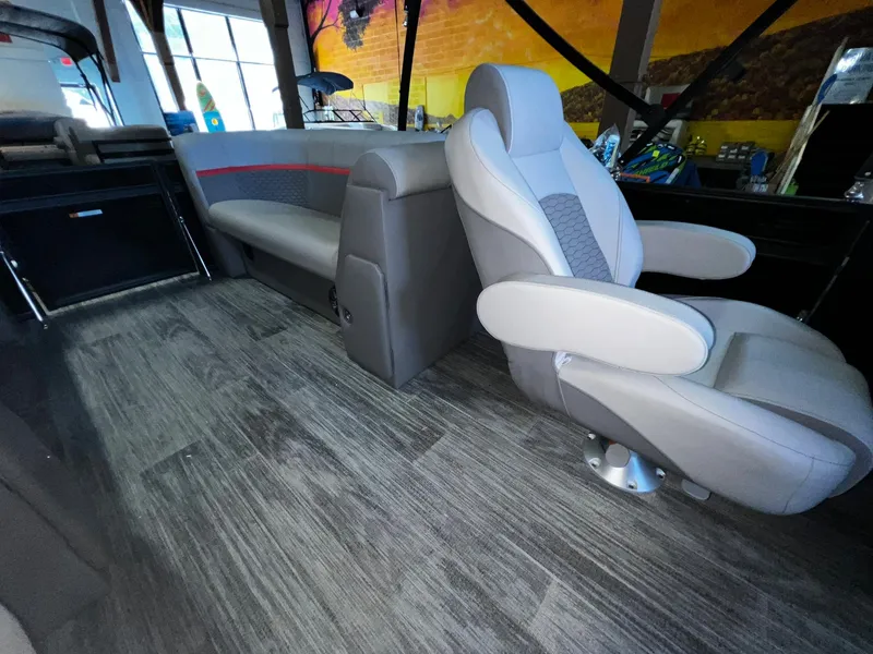 Slide: The Image of Luxurious interior of 2023 Qwest RLS 822 boat with modern seating and wood-style flooring. - 9