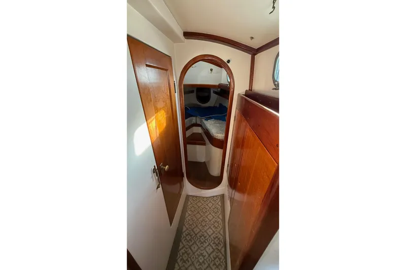 Slide: The Image of Interior of 1975 Cascade 36 sailboat with wooden finishes and cozy cabin. - 12