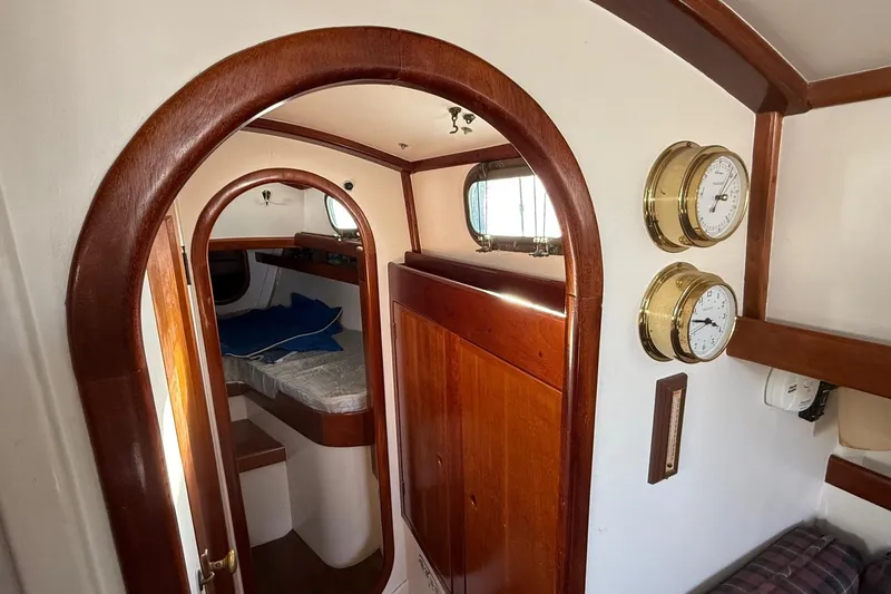 Slide: The Image of Interior of a 1975 Cascade 36 sailboat with wooden trim and nautical instruments. - 13