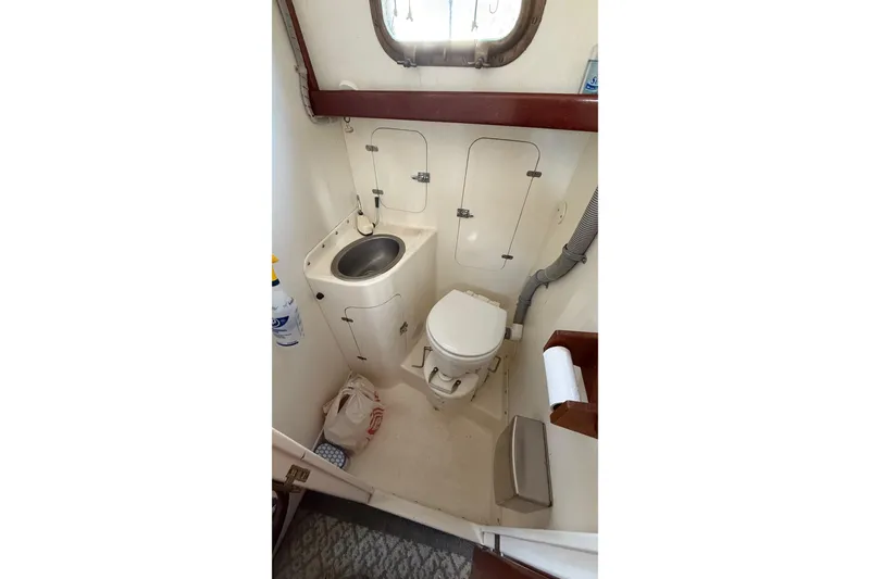 Slide: The Image of Compact bathroom in 1975 Cascade 36 boat with sink and toilet. - 16