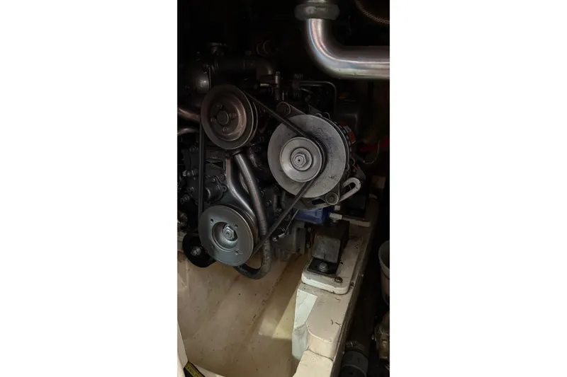 Slide: The Image of Engine components of a 1975 Cascade 36, featuring pulleys and belts. - 17