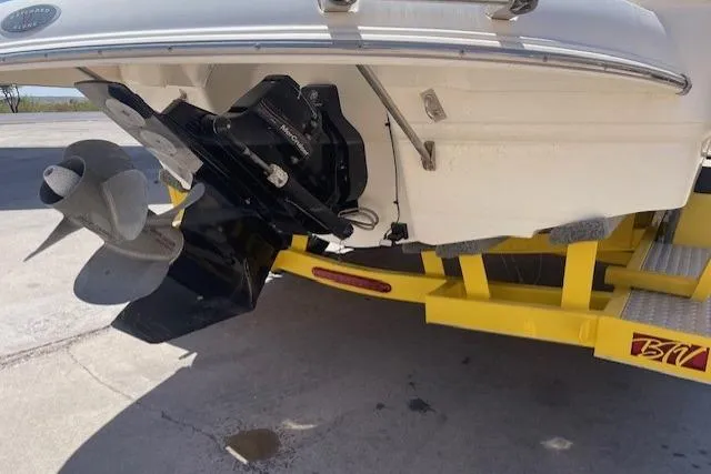 Slide: The Image of 2007 Chaparral Sunesta 232 boat on yellow trailer, showing propeller and stern drive. - 14