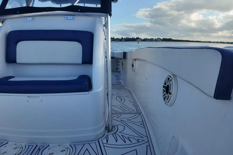 Slide: The Image of Interior of 2000 Donzi 35 boat with blue and white seating, scenic water view. - 18