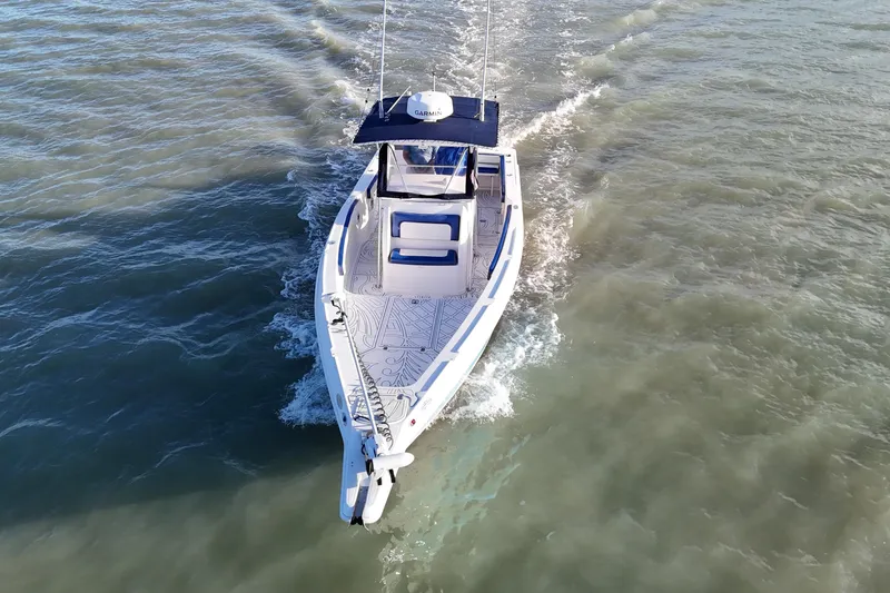 Slide: The Image of Aerial view of a 2000 Donzi 35 boat cruising on open water. - 5