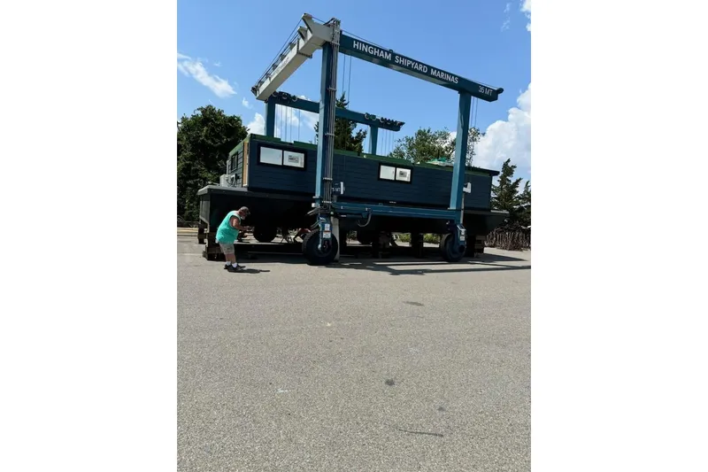 Slide: The Image of 2026 East Coast Houseboat Bayview on lift at Hingham Shipyard Marinas. - 3