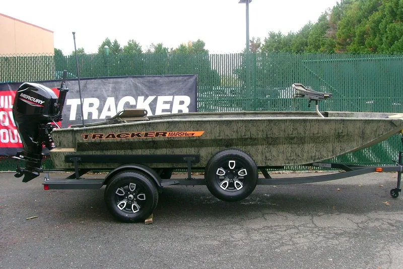 The Image of 2026 Tracker Grizzly 1756 T Marsh boat on trailer, displayed outdoors. - 0