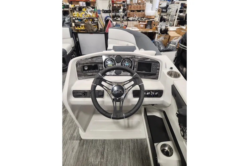 Slide: The Image of 2025 Avalon LSZ Quad Lounger dashboard with steering wheel and control panel. - 9