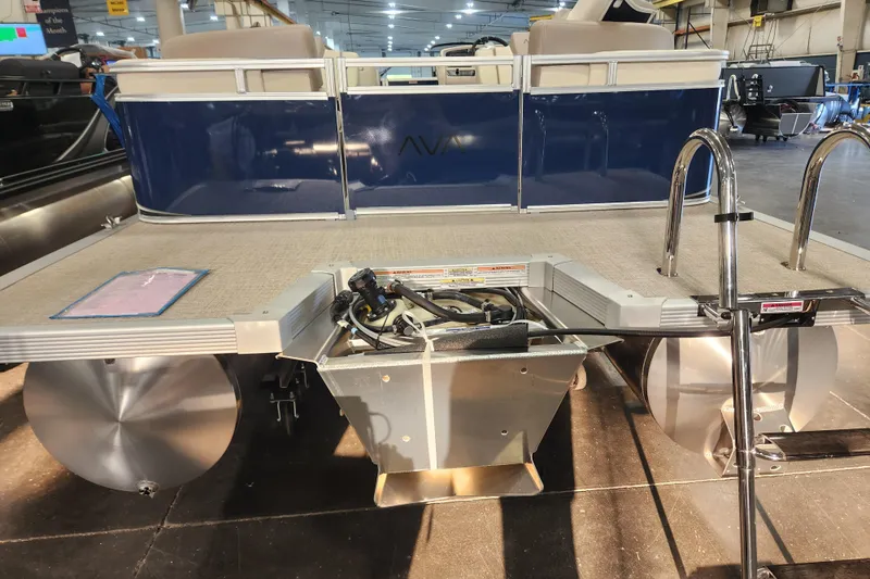 Slide: The Image of 2026 Avalon LSZ Quad Lounger pontoon boat rear view in showroom. - 9