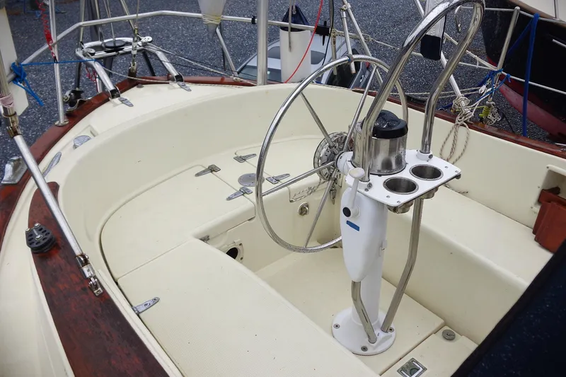 Slide: The Image of Cockpit of 1998 Pacific Seacraft 37 sailboat with steering wheel and cup holders. - 3