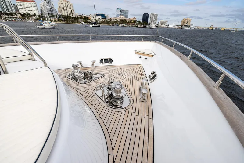 Slide: The Image of Luxurious 1999 Azimut 100 Jumbo yacht deck with sleek wood finish and ocean view. - 11