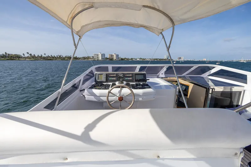 Slide: The Image of Helm of 1999 Azimut 100 Jumbo yacht with ocean view and canopy. - 15